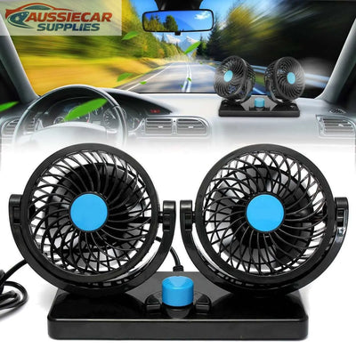 Car fan mounted on a car dashboard with a blurred road and trees in the background