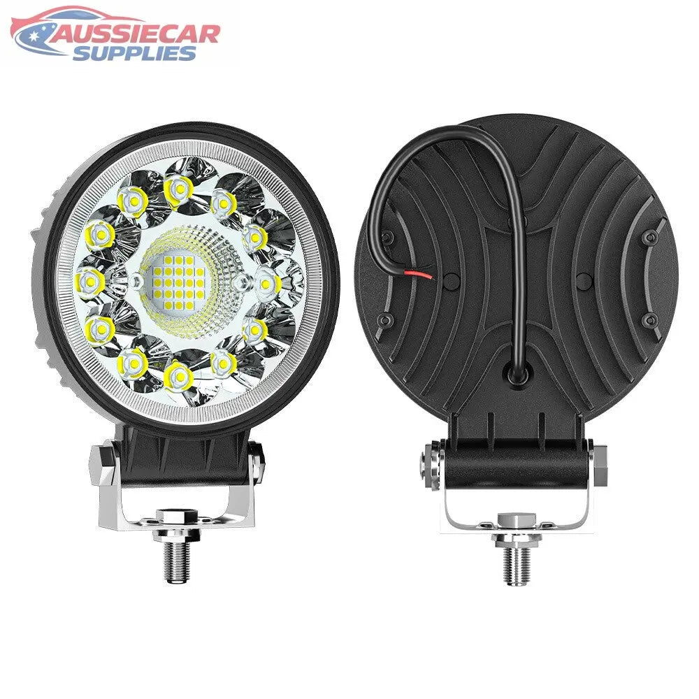 Two round LED work lights on a white background