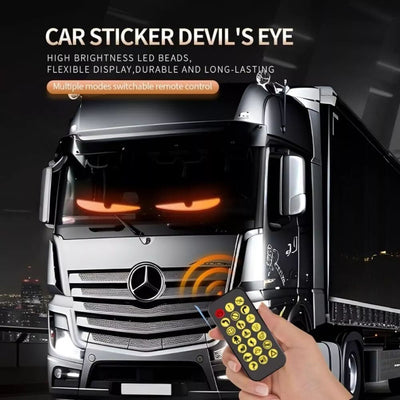 Truck with Devil's Eye car sticker and remote control on a dark background