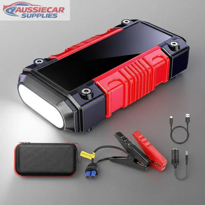 Red and black power bank with accessories on a dark background