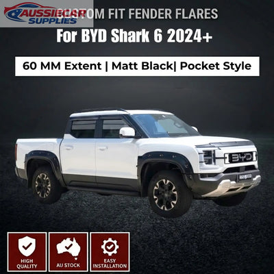 White BYD Shark 6 truck with custom fit fender flares on a dark background