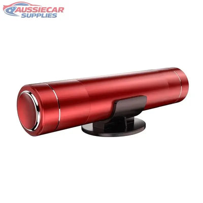 Red cylindrical device with a black base on a white background