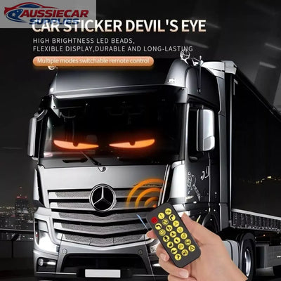 Truck with Devil's Eye car sticker and remote control on a dark background