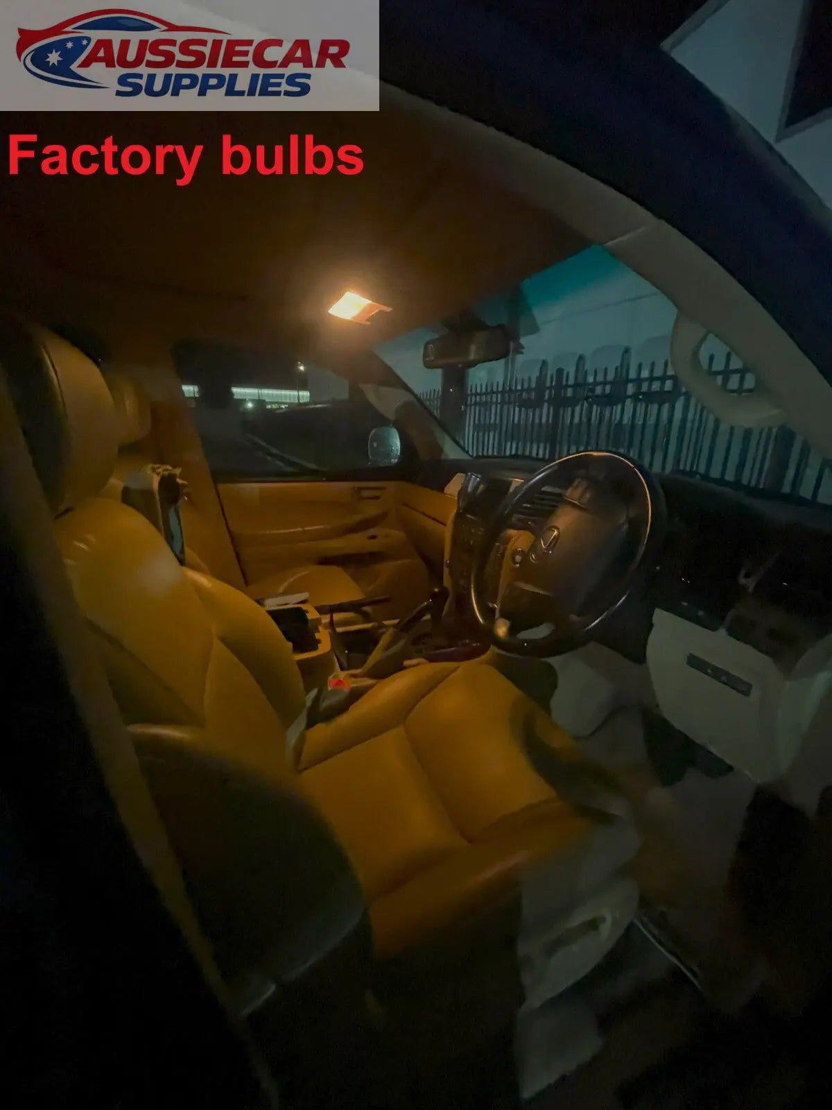 Car interior with 'Factory bulbs' text, showing dashboard and steering ...