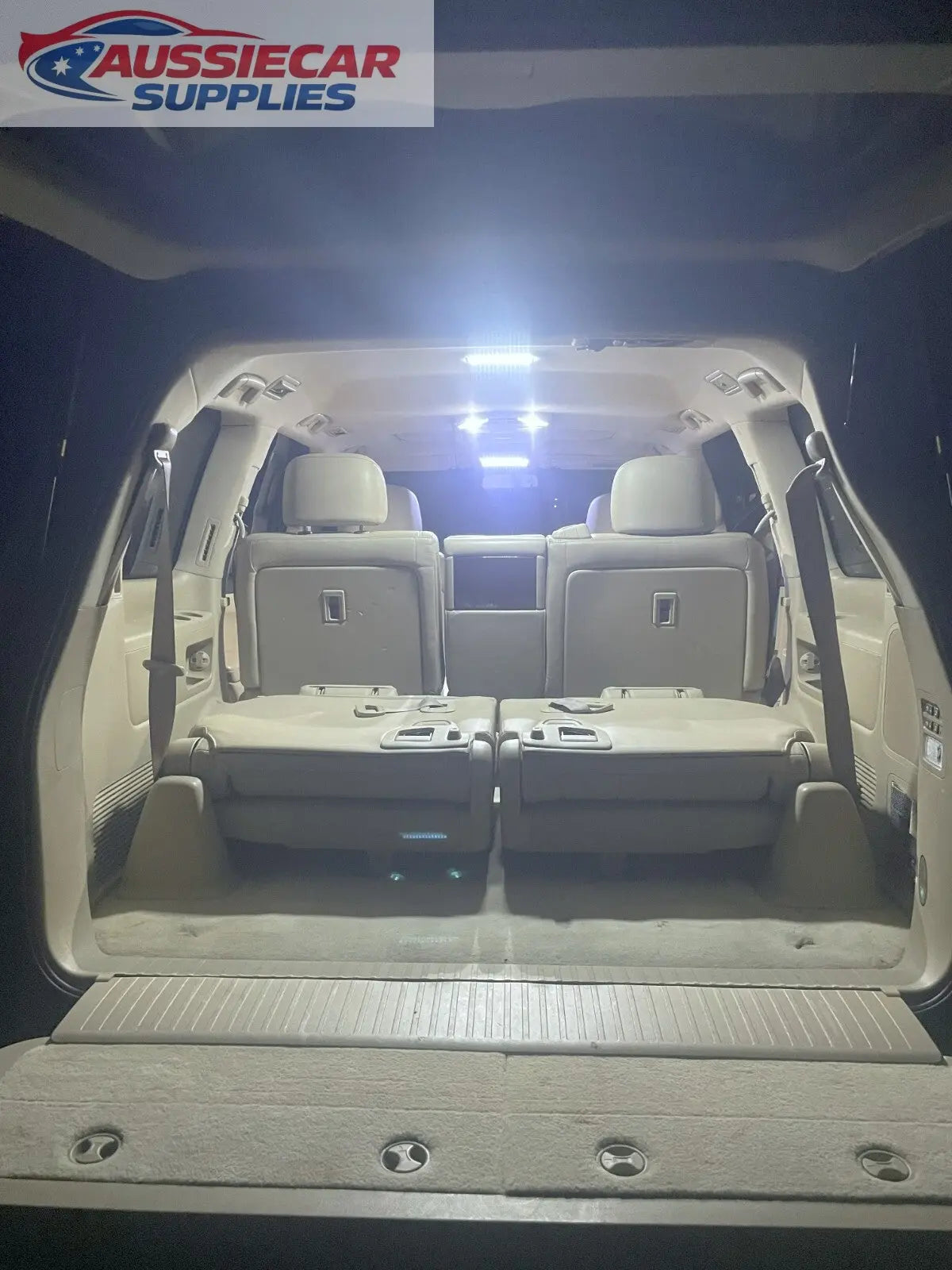 Open car trunk with beige interior and visible floor. 200 series ...