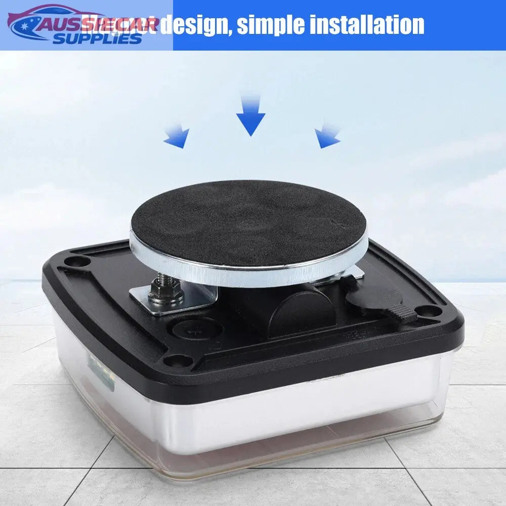 Magnetic device with a black top and clear base on a light gray floor.